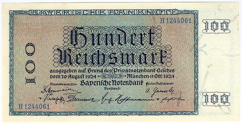 100 Reichsmark: Rechts im weißen Feld sind als Sicherheitsmerkmale die eingestreuten Seidenpapierstreifen zu sehen.