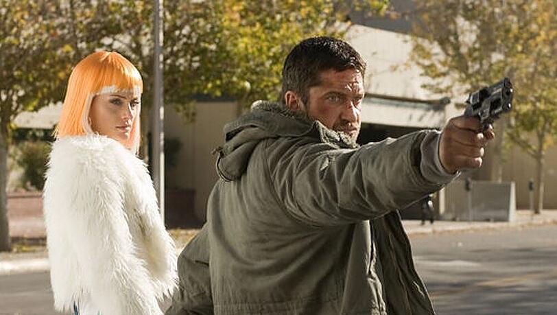 Gerard Butler (re.) versucht in dem Actionfilm "Gamer" seine Frau Amber Valletta (li.) zu schützen Gerard Butler (re.) versucht in dem Actionfilm "Gamer" seine Frau Amber Valletta (li.) zu schützen