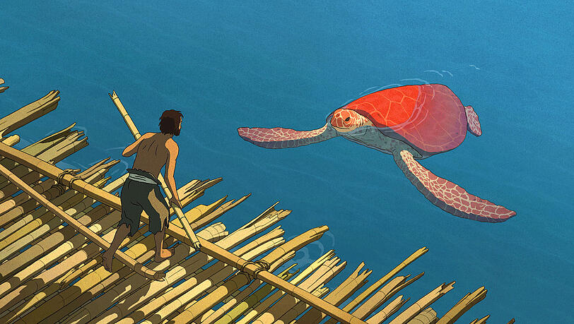 Eine rote Schildkröte verhindert die Flucht des Schiffbrüchigen. Eine rote Schildkröte verhindert die Flucht des Schiffbrüchigen.