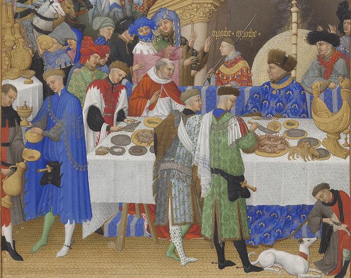 Mit diesem fulminanten Neujahrsempfang beginnen die Monatsdarstellungen in den „Très Riches Heures“, dem berühmtesten Stundenbuch des Mittelalters. Der Herzog von Berry - rechts am Tisch mit Bärenfellhut - begrüßt seine Gäste und ist dabei der einzige, der etwas zu essen bekommt. Bis auf die kleinen Hunde auf dem Tisch.