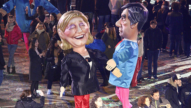 Beliebtes Motiv bei Faschingssumzügen (hier Nizza): Figuren von Marine Le Pen und François Fillon. Beliebtes Motiv bei Faschingssumzügen (hier Nizza): Figuren von Marine Le Pen und François Fillon.