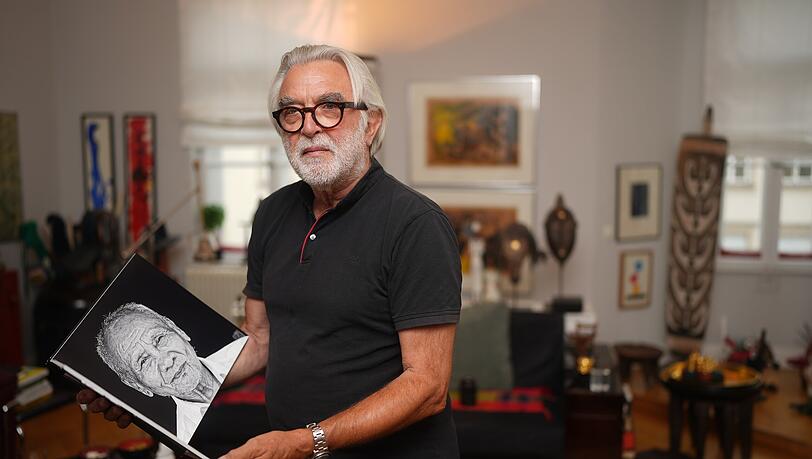 Schwabinger mit Helfer-Gen: Interplast-Chirurg Heinrich Schoeneich (78) mit seinem Fotobuch aus Myanmar.