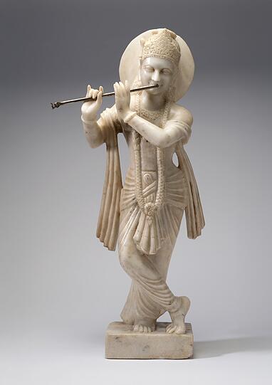 Dieser Flöte spielende Krishna aus Marmor ist im 20. Jahrhundert in Nordindien geschaffen worden. Dieser Flöte spielende Krishna aus Marmor ist im 20. Jahrhundert in Nordindien geschaffen worden.