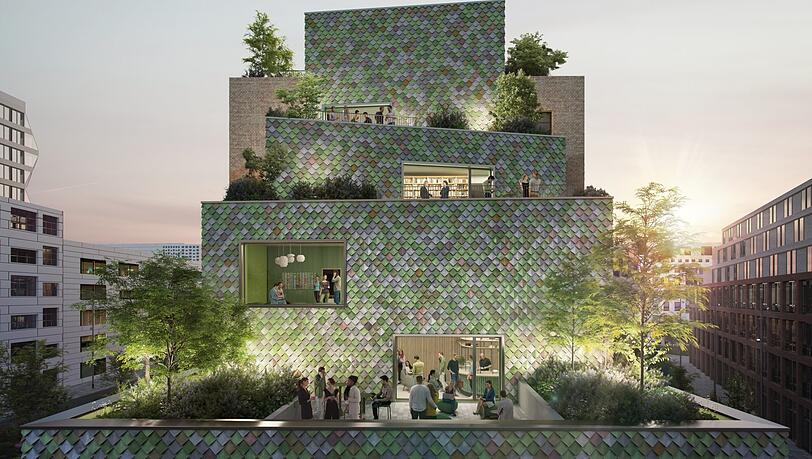 Ein Hingucker aus jeder Richtung: So wird das kleine Bürohaus "Monaco" im Werksviertel mit seiner Recycle-Fassade aussehen. Es soll bis 2027 an der Helmut-Dietl-Straße fertig werden, zwischen den Hochhäusern Atlas und Highrise One.