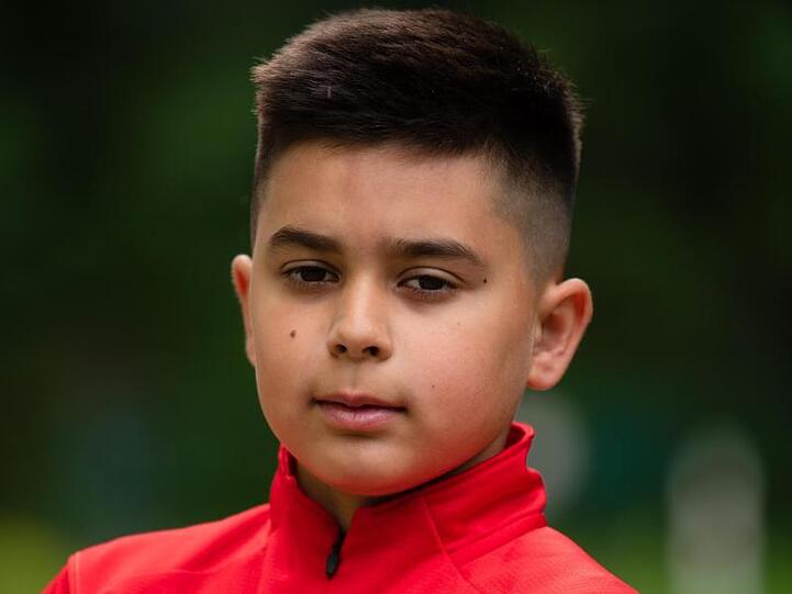 Kenan, 10 Jahre alt, posiert für ein Foto. Foto: Nicolas Armer