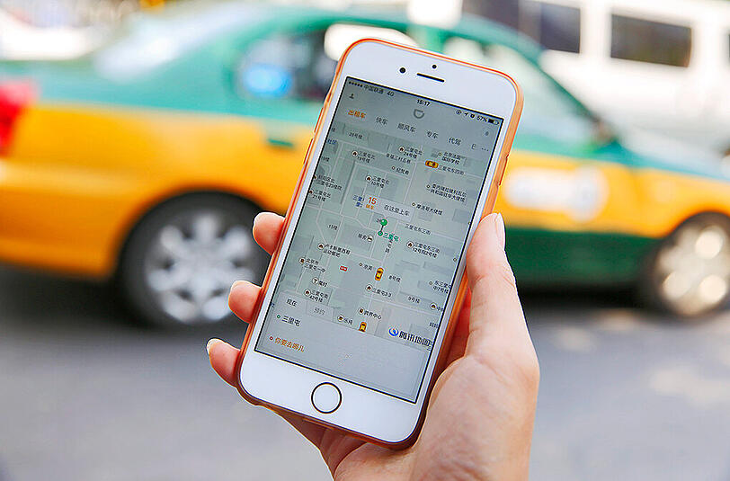 Das Fahrdienst-Geschäft in China ist heiß umkämpft. Foto: How Hwee Young/Illustration
