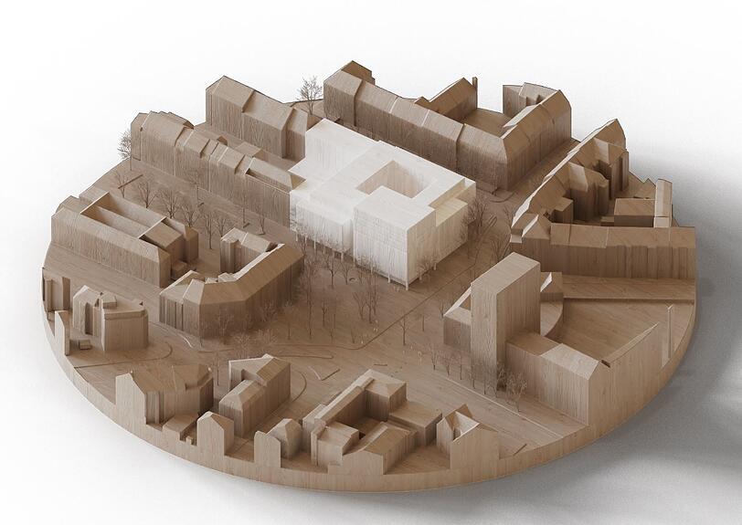 Anstelle des Kaufhauses ist ein gro&szlig;er Neubau (wei&szlig;) vorgesehen. Vorne rechts auf dem Modell: das Schwesternhochhaus des Rotkreuzklinikums.