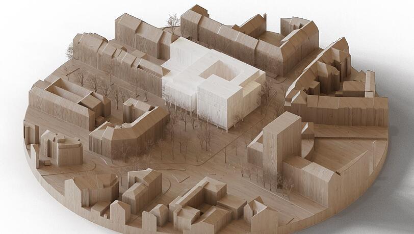 Anstelle des Kaufhauses ist ein gro&szlig;er Neubau (wei&szlig;) vorgesehen. Vorne rechts auf dem Modell: das Schwesternhochhaus des Rotkreuzklinikums.