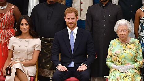 Queen Elizabeth II., Prinz Harry und Herzogin Meghan (v.r.n.l.) im Jahr 2018.