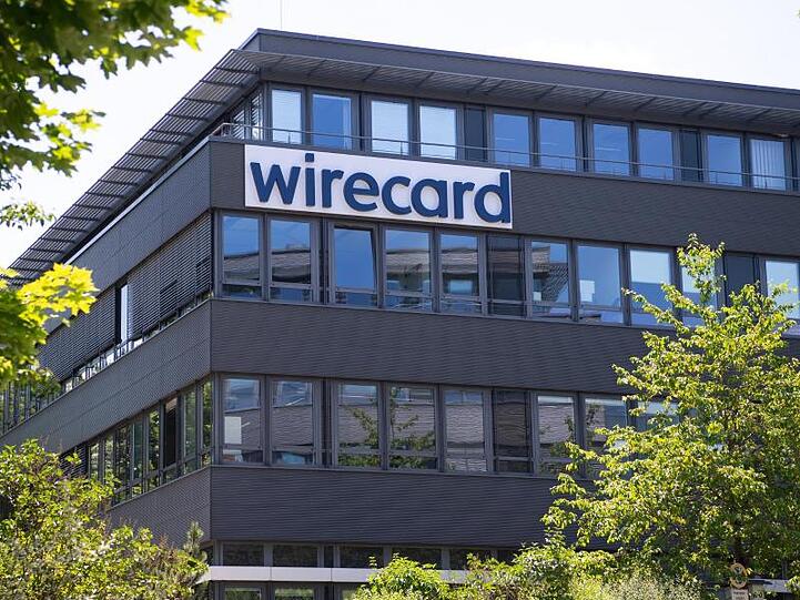 Der Schriftzug von Wirecard ist an der Firmenzentrale zu sehen. Foto: Sven Hoppe/dpa/Symbolbild