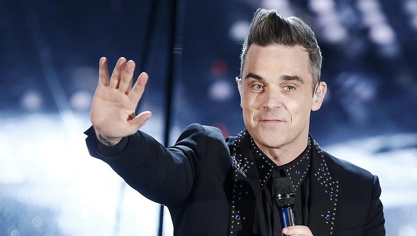 Robbie Williams, hier auf einem Konzert in Italien, spricht darüber, dass ein Auftragsmörder ihn umbringen sollte.