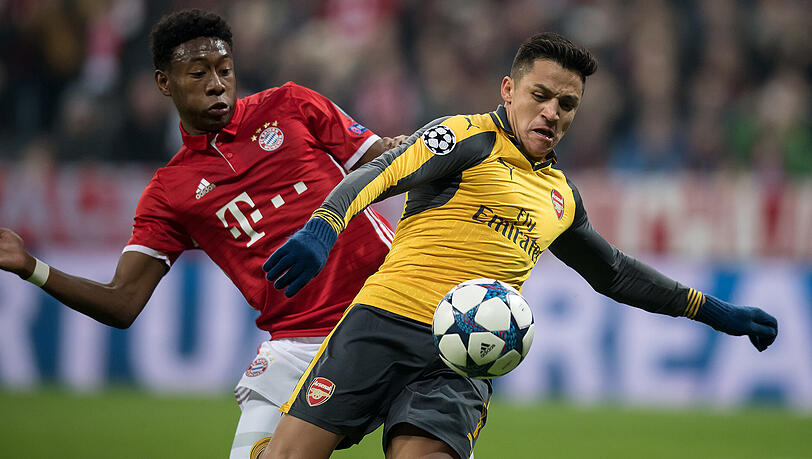 Demnächst Teamkollegen? David Alaba vom FC Bayern (links) im Zweikampf mit Alexis Sanchez vom FC Arsenal. Szene aus dem Achtelfinal-Hinspiel der Champions League am 15. Februar in der Allianz Arena. Demnächst Teamkollegen? David Alaba vom FC Bayern (links) im Zweikampf mit Alexis Sanchez vom FC Arsenal. Szene aus dem Achtelfinal-Hinspiel der Champions League am 15. Februar in der Allianz Arena.