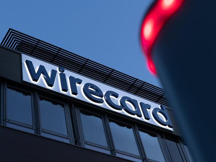 Der Schriftzug von Wirecard ist an der Firmenzentrale zu sehen. Foto: Peter Kneffel/dpa/Symbolbild