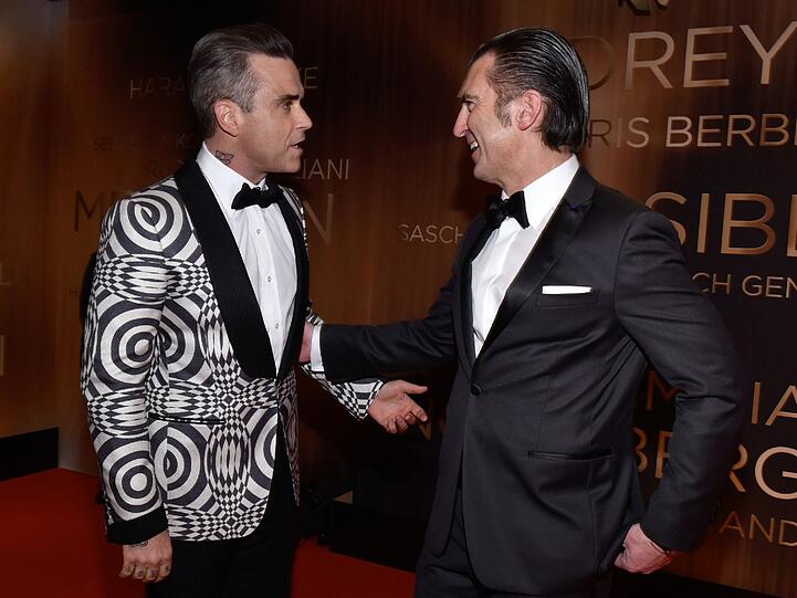 Robbie Williams (l) und Philipp Welte
