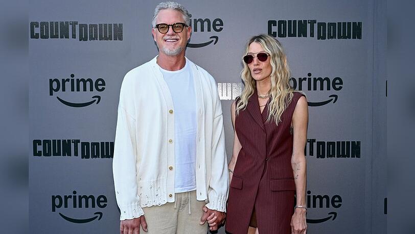 Eric Dane und Janell Shirtcliff händchenhaltend auf dem roten Teppich.