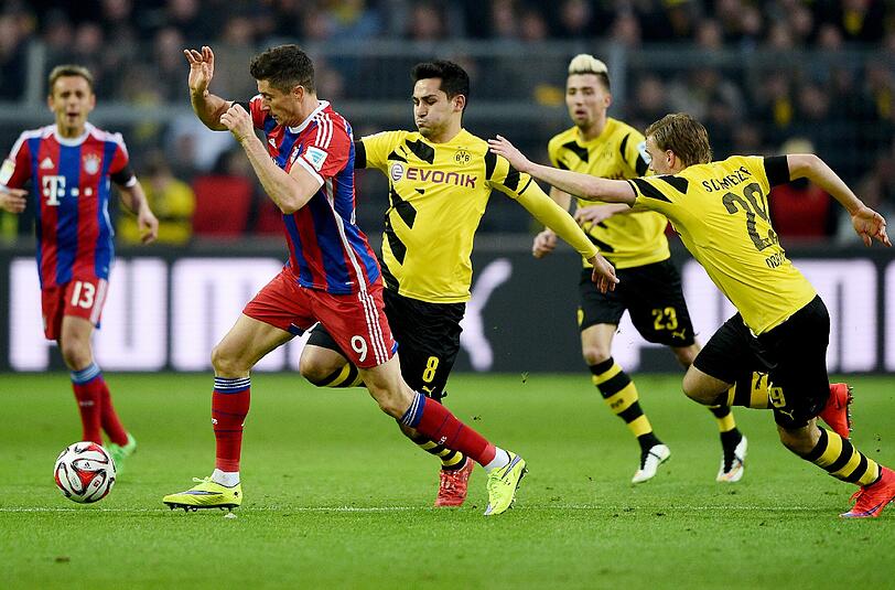 Beim Bundesligaspiel setzt sich Robert Lewandwoski (l.) gegen Ilkay Gündogan, Kevin Kampl und Marcel Schmelzer durch.
