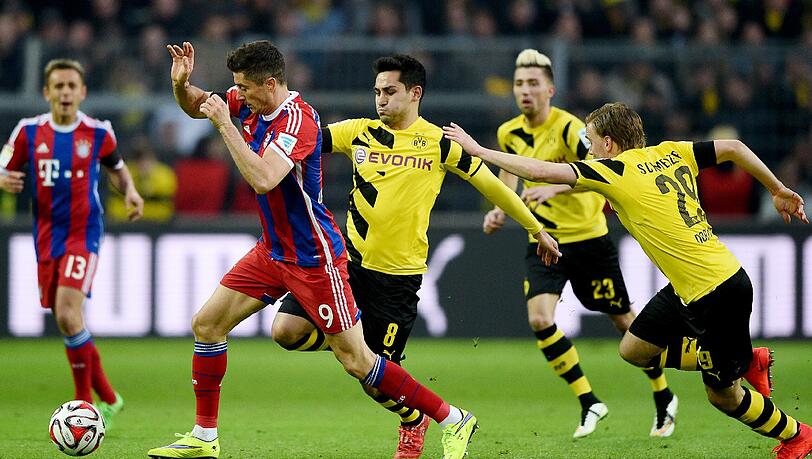 Beim Bundesligaspiel setzt sich Robert Lewandwoski (l.) gegen Ilkay Gündogan, Kevin Kampl und Marcel Schmelzer durch. Beim Bundesligaspiel setzt sich Robert Lewandwoski (l.) gegen Ilkay Gündogan, Kevin Kampl und Marcel Schmelzer durch.