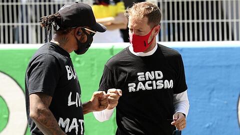 Für einen Boykott als Zeichen gegen Rassismus und Polizeigewalt sehen Lewis Hamilton (l) und Sebastian Vettel die Zeit nicht gekommen.