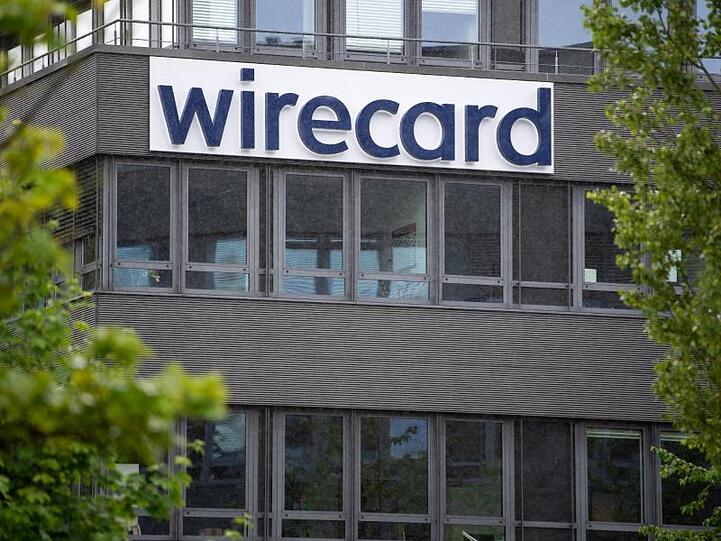Der Schriftzug von Wirecard ist an der Firmenzentrale zu sehen. Foto: Sven Hoppe/dpa/Archivbild