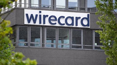 Der Schriftzug von Wirecard ist an der Firmenzentrale zu sehen. Foto: Sven Hoppe/dpa/Archivbild