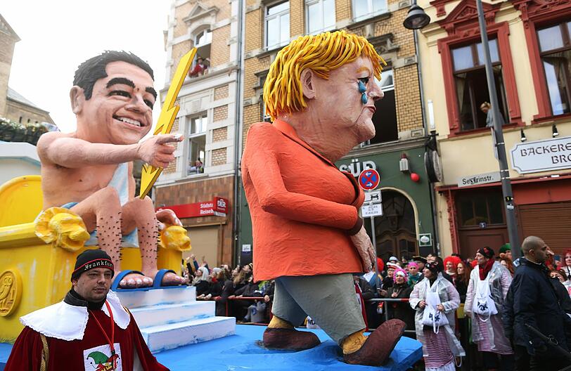 "Raus aus der Drachme": Die Kanzlerin und "Zeus-Tsipras" in Köln.