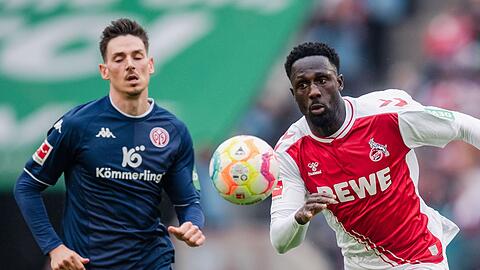 Kölns Kingsley Schindler (r) und der Mainzer Anthony Caci im Laufduell.