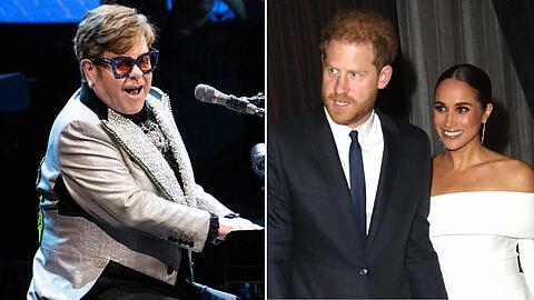 Elton John sorgte für einen skurrilen Moment, als er auf seinem München-Konzert ein Foto von Harry und Meghan zeigte.