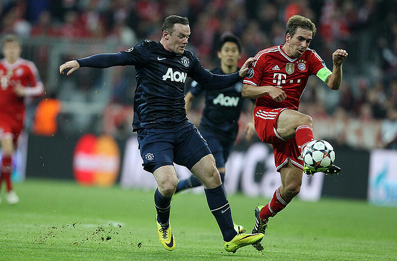 2013/14 war für ManUnited (l.: Wayne Rooney) im Viertelfinale gegen Bayern (r.: Philipp Lahm) Endstation.