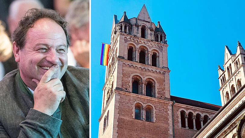Bunter Protest-Gruß an den Papst: Die Regenbogenfahne hängt als Zeichen am Turm von St. Maximilian. Bunter Protest-Gruß an den Papst: Die Regenbogenfahne hängt als Zeichen am Turm von St. Maximilian.