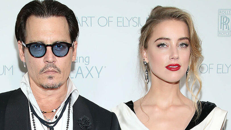 Amber Heard mit Johnny Depp auf einer Veranstaltung im Januar: Weiß steht ihr schon mal gut Amber Heard mit Johnny Depp auf einer Veranstaltung im Januar: Weiß steht ihr schon mal gut