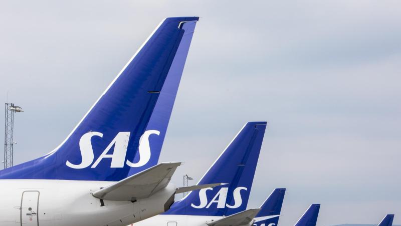 Flugzeuge der skandinavischen Fluggesellschaft SAS stehen am Terminal des Flughafens Gardermoen in Oslo. Flugzeuge der skandinavischen Fluggesellschaft SAS stehen am Terminal des Flughafens Gardermoen in Oslo.