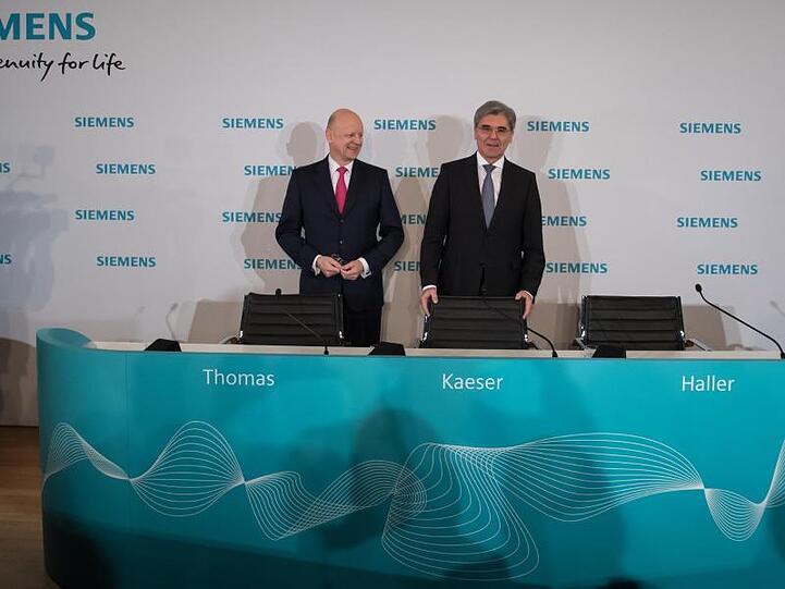 Joe Kaeser (r), Vorstandsvorsitzender der Siemens AG, und Ralf Thomas, Finanzvorstand der Siemens AG. Foto: Sven Hoppe