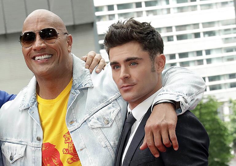 Die Schauspieler Dwayne Johnson und Zac Efron