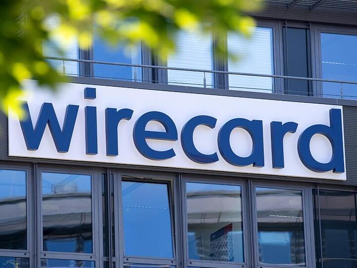 Der Schriftzug von Wirecard ist an der Firmenzentrale des Zahlungsdienstleisters zu sehen. Foto: Sven Hoppe/dpa/Archivbild