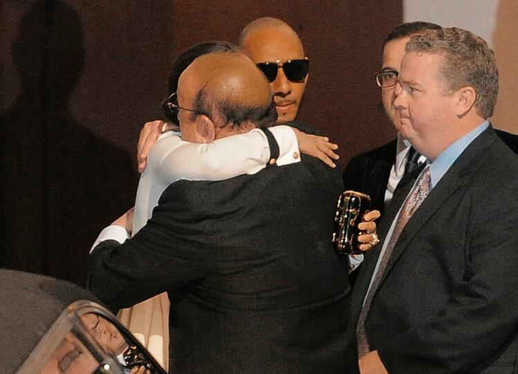 Alicia Keys hugs Clive Davis.