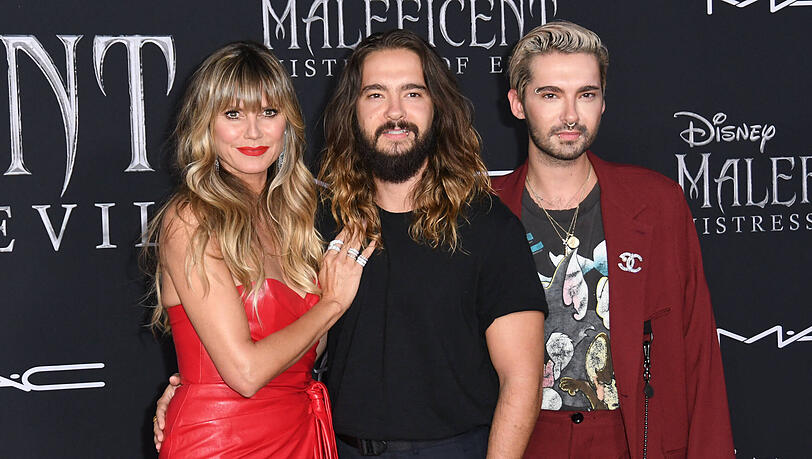 Heidi Klum und Tom Kaulitz (M.) sind noch immer schwer verliebt. Der Beziehungsstatus von Bill (re.) wirft hingegen manchmal Fragen auf.
