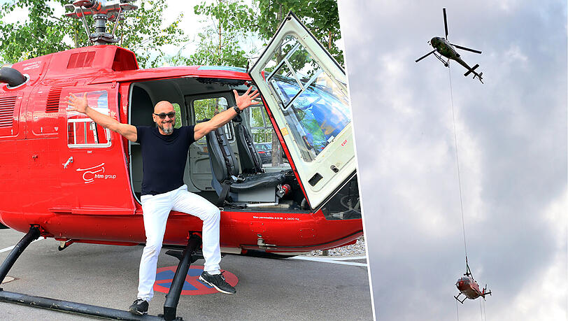 Der Unternehmer Jochen Schweizer posiert vor dem Bölkow BO 105, der von einem anderen Helikopter nach Taufkirchen transportiert wurde. Der Unternehmer Jochen Schweizer posiert vor dem Bölkow BO 105, der von einem anderen Helikopter nach Taufkirchen transportiert wurde.