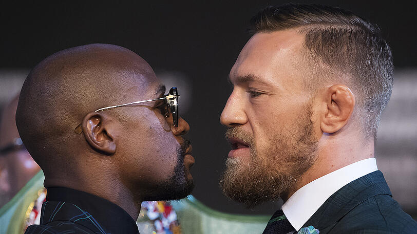 Treffen am Sonntag aufeinander: Box-Champions Floyd Mayweather (l.) und UFC-Kämpfer Conor McGregor.