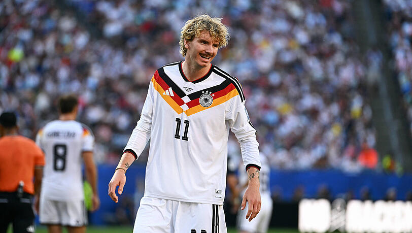 Eine Frisur wie einst Rudi Völler: Nick Woltemade. Eine Frisur wie einst Rudi Völler: Nick Woltemade.