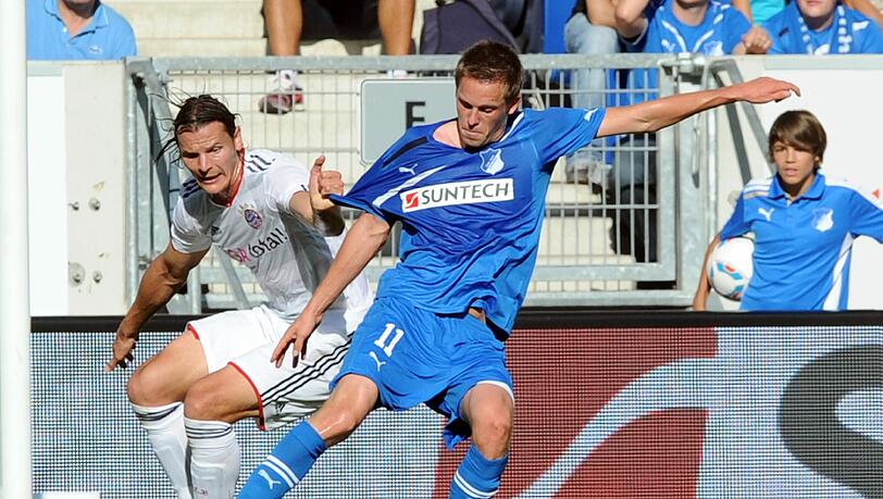 Bayerns Daniel van Buyten im Zweikampf mit dem Hoffenheimer Gylfi Sigurdsson. Bayerns Daniel van Buyten im Zweikampf mit dem Hoffenheimer Gylfi Sigurdsson.