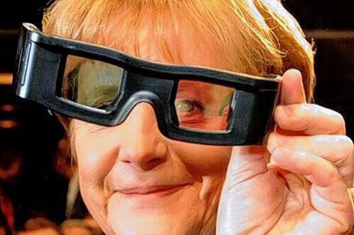 Kanzlerin Merkel probiert bei der Cebit eine 3D-Shutterbrille aus