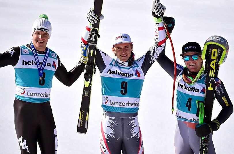 Die ersten Drei der Abfahrt in Lenzerheide: Matthias Mayer (m.), Christof Innerhofer (l.) und Ted Ligety (r.).