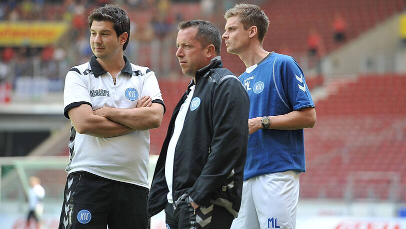 Archivbild vom 04.08.2012: Co-Trainer Argirios Giannikis, Cheftrainer Markus Kauczinski und Athletik-Trainer Marc Lorius in Diensten des Karlsruher SC. Archivbild vom 04.08.2012: Co-Trainer Argirios Giannikis, Cheftrainer Markus Kauczinski und Athletik-Trainer Marc Lorius in Diensten des Karlsruher SC.