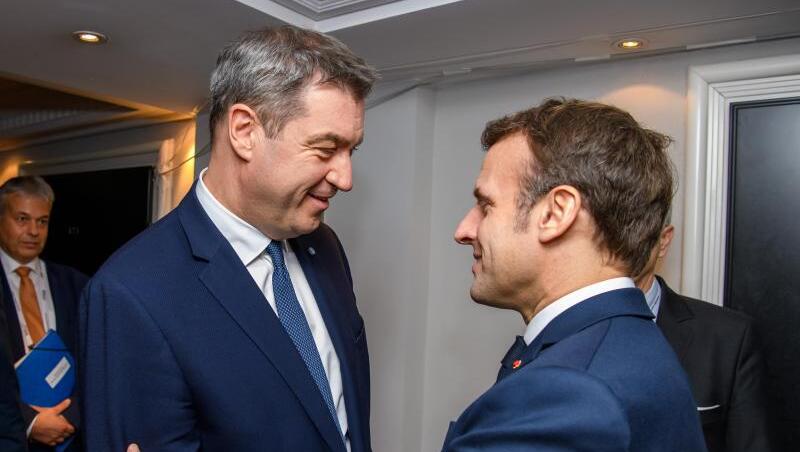 Markus Söder (l)trifft im Rahmen der Münchner Sicherheitskonferenz Emmanuel Macron. Foto: Jörg Koch/Bayerische Staatskanzlei/dpa