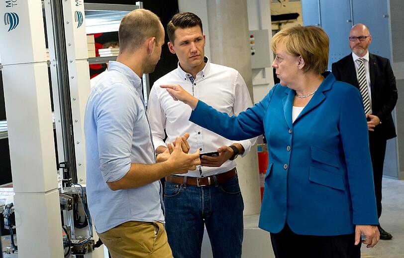 Angela Merkel bei ihrem Besuch der Technischen Universität in Garching. Hier die Bilder.