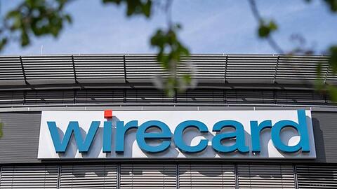 Der Schriftzug von Wirecard hängt an der Zentrale des Zahlungsdienstleisters. Foto: Peter Kneffel/Archiv