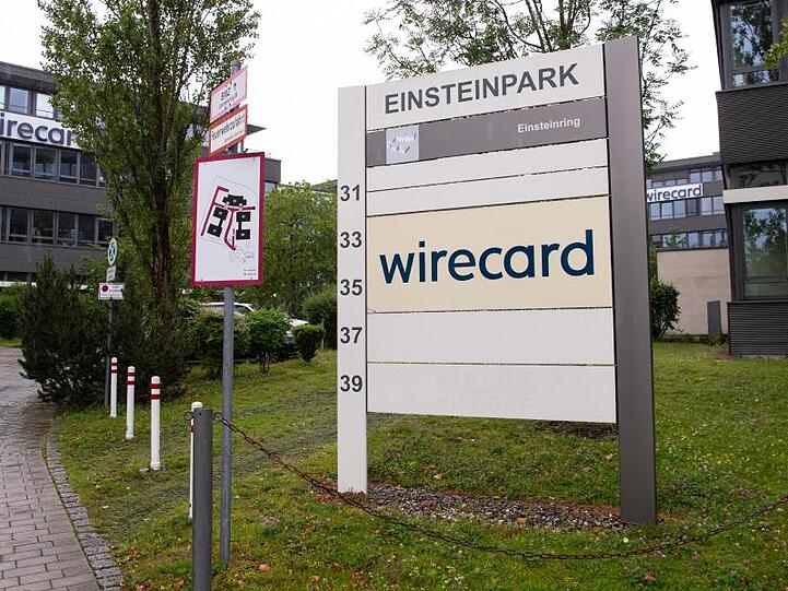 Der Schriftzug von Wirecard ist an der Firmenzentrale des Zahlungsdienstleisters zu sehen. Foto: Sven Hoppe/dpa/Archivbild