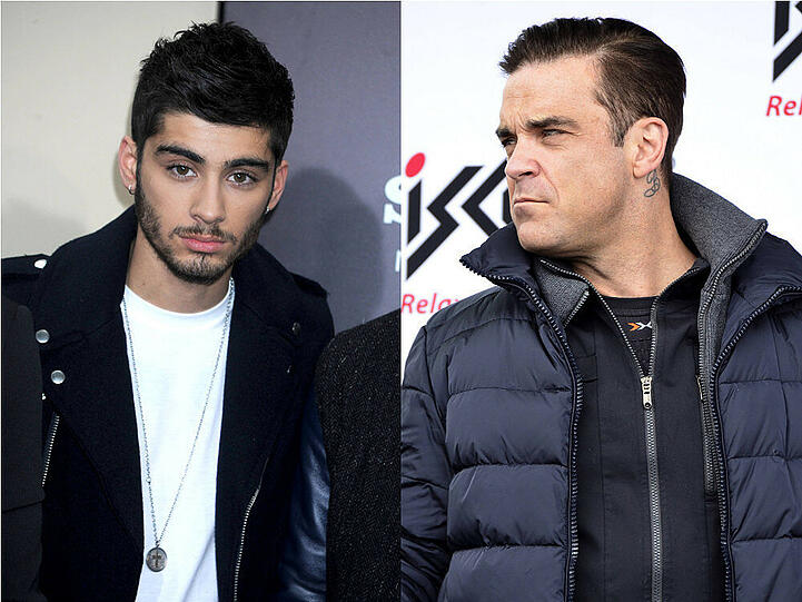 Zayn Malik (l.) bekommt einen Rüffel von Robbie Williams