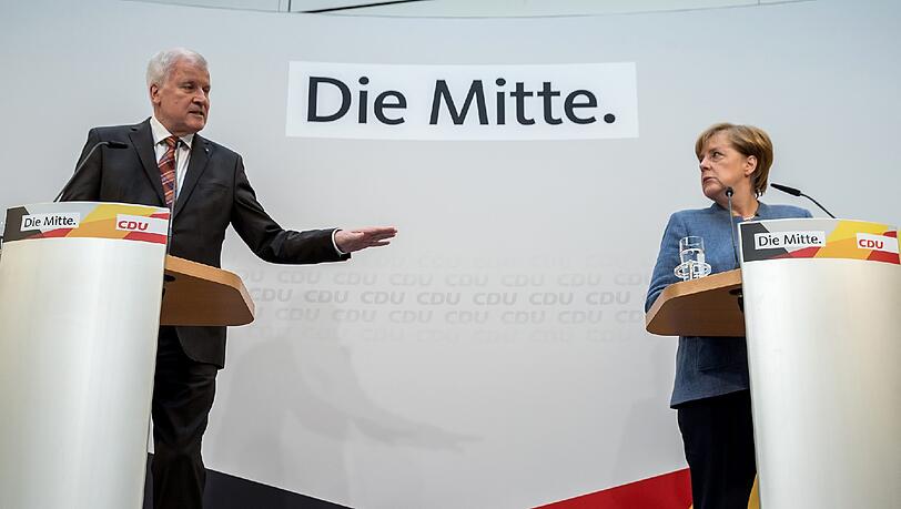 Seehofer und Merkel: Partner wider Willen. Seehofer und Merkel: Partner wider Willen.