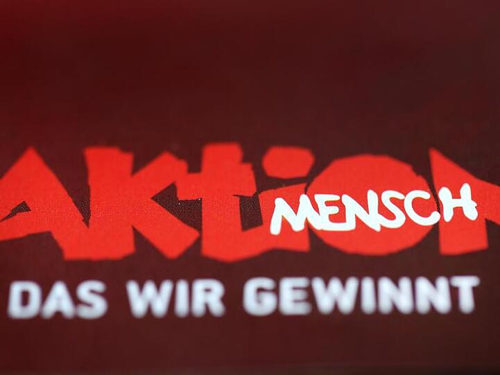 Schriftzug der Lotterie "Aktion Mensch". Foto: picture alliance / dpa/Archivbild